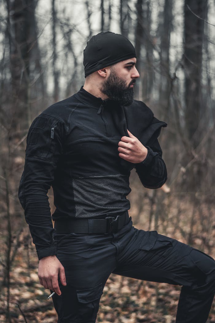 Crafting Captivating Headlines: Your awesome post title goes here Bearded man in black tactical clothing standing in a winter forest.